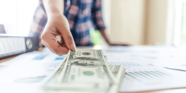 Local small business owner in Dallas receiving payment or funding for services rendered