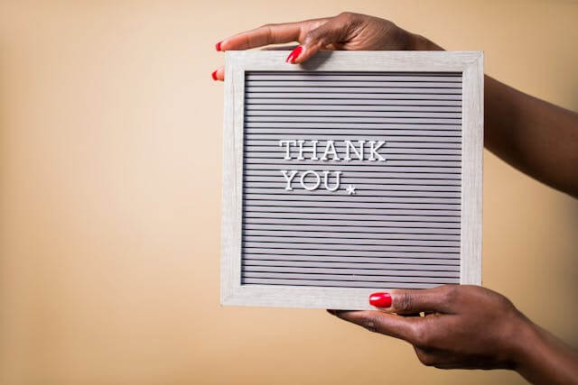 Letter board displaying a thank you message to customers.