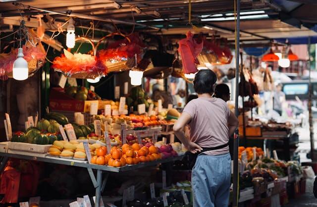 usy local market scene representing community interests and local engagement through Facebook Groups