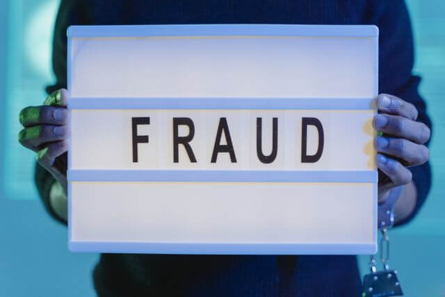 Fraud sign representing fake Google reviews and misleading online review practices for small businesses.